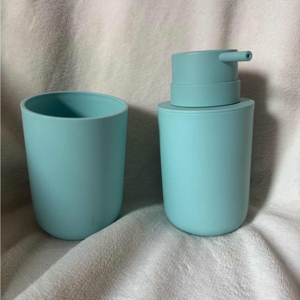 Bathroom soap dispenser and cup